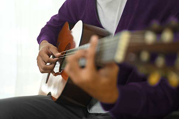 Man playing acoustic guitar
